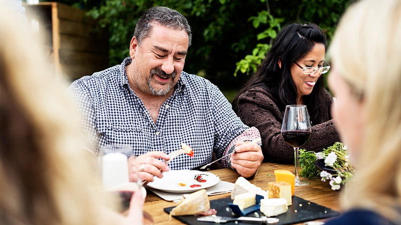 adults dining outdoors